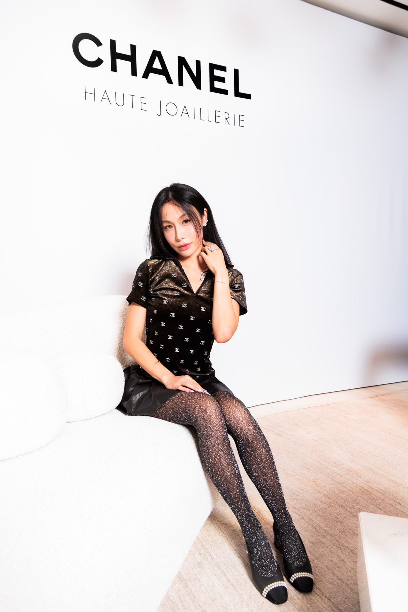 Chelsea seated at the Chanel high-jewellery presentation